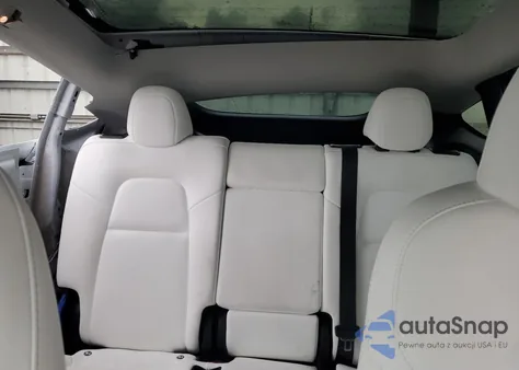 2023 Tesla Model Y from USA, damaged, VIN 7SAYGDED1PF962095